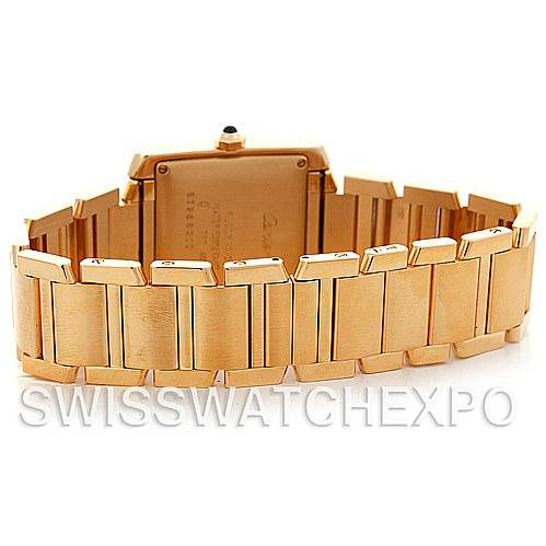 The image shows the backside and bracelet of a Cartier Tank Francaise W50001R2 Men's Yellow Gold Silver Dial W50001R2 Men's Yellow Gold Silver Dial watch, highlighting its gold links and clasp.