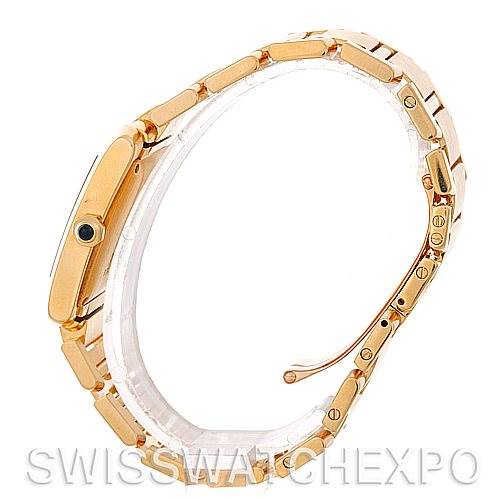 This image shows a side view of the Cartier Tank Francaise W50001R2 Men's Yellow Gold Silver Dial W50001R2 Men's Yellow Gold Silver Dial watch, highlighting the bracelet and distinct crown.