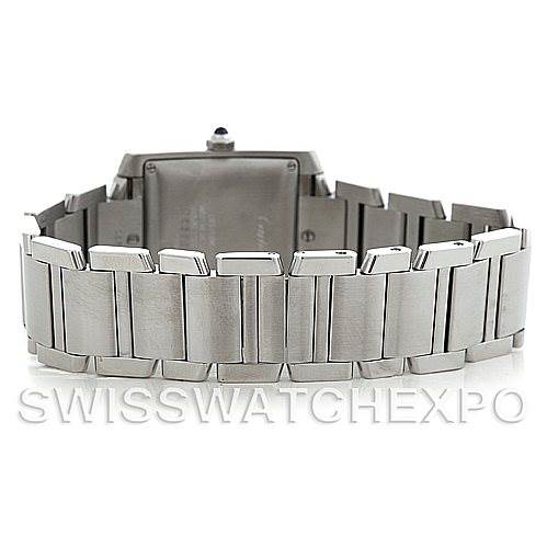 The image shows the back side and the metal bracelet of a Cartier Tank Française watch.