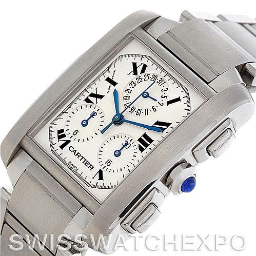 The image shows a close-up angle of the Cartier Tank Française watch, highlighting its dial, blue hands, crown, and stainless steel bracelet.