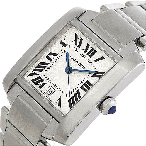 The image shows a close-up angle of a Cartier Tank Française watch, highlighting its face, Roman numerals, and part of the bracelet.