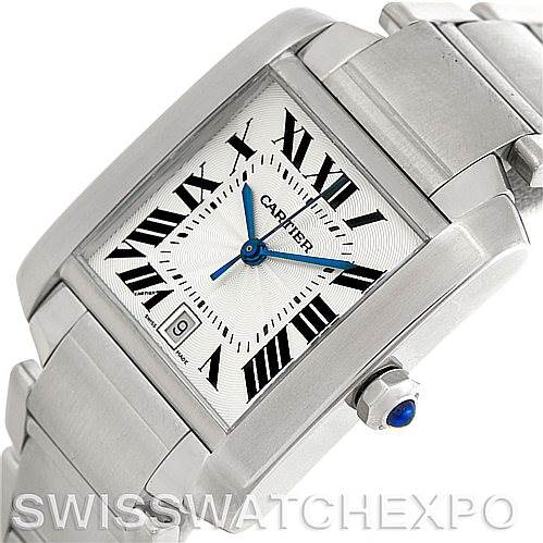 This image shows a close-up angled view of the Cartier Tank Francaise W51002Q3 Men's Stainless Steel Silver Dial W51002Q3 Men's Stainless Steel Silver Dial watch, highlighting the dial, Roman numerals, blue hands, and part of the bracelet.