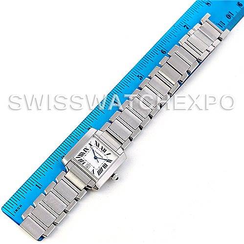 The image shows the Cartier Tank Francaise W51002Q3 Men's Stainless Steel Silver Dial W51002Q3 Men's Stainless Steel Silver Dial watch laid flat against a ruler, displaying its face and entire metal bracelet.