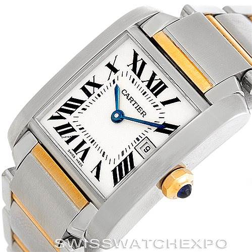 The Cartier Tank Française watch is shown at an angled close-up, displaying the face, crown, and part of the bracelet.