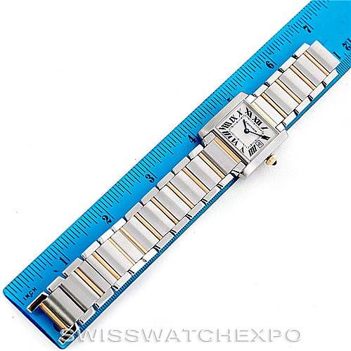 This image shows the Cartier Tank Francaise W51012Q4 Women's Steel and Gold (two tone) Silver Dial W51012Q4 Women's Steel and Gold (two tone) Silver Dial watch laid flat next to a ruler for size reference.