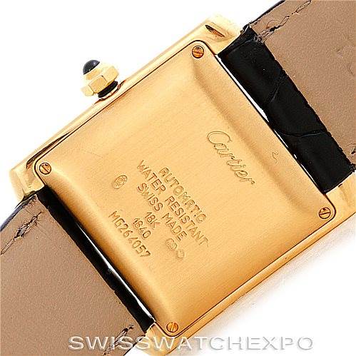 The image shows the case back of a Cartier Tank Francaise W5000156 Men's Yellow Gold Silver Dial W5000156 Men's Yellow Gold Silver Dial watch, highlighting its inscriptions and part of the watch strap.