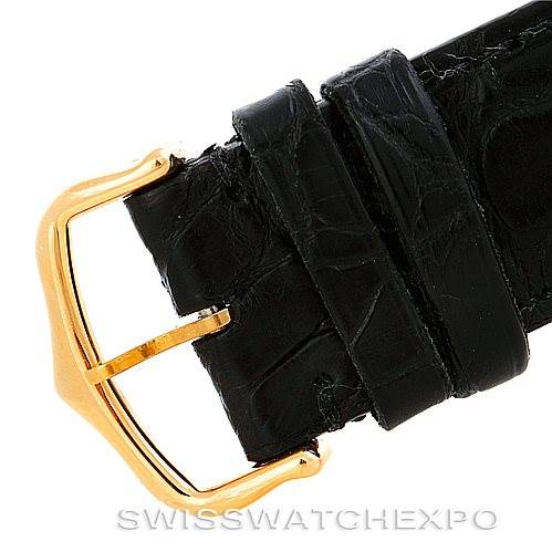 The image shows a close-up of the black leather strap and gold buckle of the Cartier Tank Francaise W5000156 Men's Yellow Gold Silver Dial W5000156 Men's Yellow Gold Silver Dial watch.