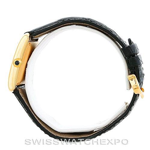 This image shows a side view of the Cartier Tank Francaise W5000156 Men's Yellow Gold Silver Dial W5000156 Men's Yellow Gold Silver Dial watch, highlighting its profile, crown, and leather strap with a buckle.