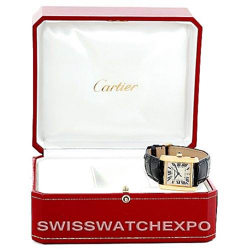 This image shows a Cartier Tank Francaise W5000156 Men's Yellow Gold Silver Dial W5000156 Men's Yellow Gold Silver Dial watch positioned inside an open Cartier box.