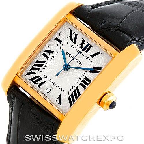 The image shows a close-up, angled view of the Cartier Tank Française watch, highlighting the gold case, Roman numeral dial, and black leather strap.