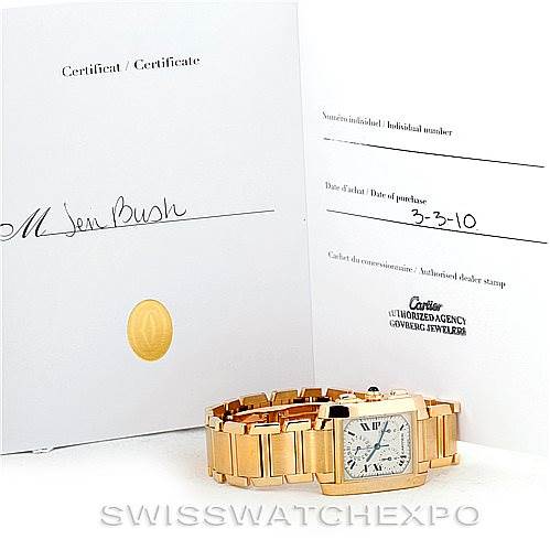 The image shows a Cartier Tank Française watch positioned flat, with its certificate and date of purchase in the background.