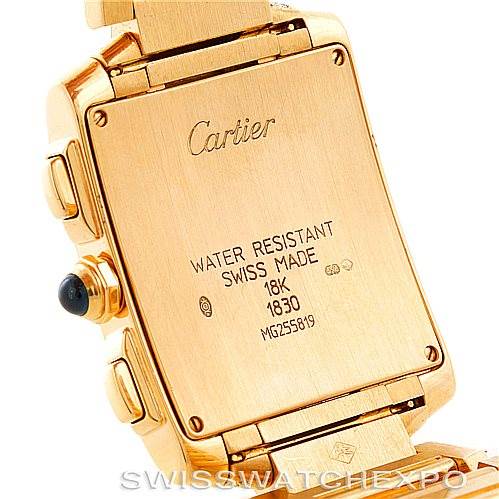 The image shows the back of a Cartier Tank Francaise W50005R2 Men's Yellow Gold Silver Dial W50005R2 Men's Yellow Gold Silver Dial watch, highlighting its case back, stampings, and parts of the bracelet.
