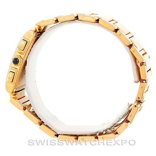 The image shows a Cartier Tank Française watch from the side angle, focusing on its gold bracelet and crown.