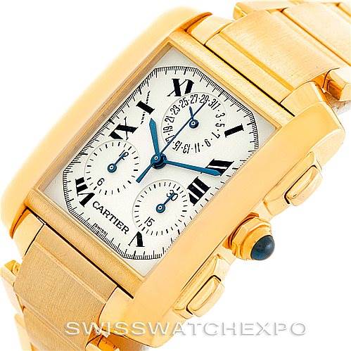 The Cartier Tank Francaise W50005R2 Men's Yellow Gold Silver Dial W50005R2 Men's Yellow Gold Silver Dial watch is shown at an angled top view, highlighting its rectangular face, gold casing, and linked bracelet.