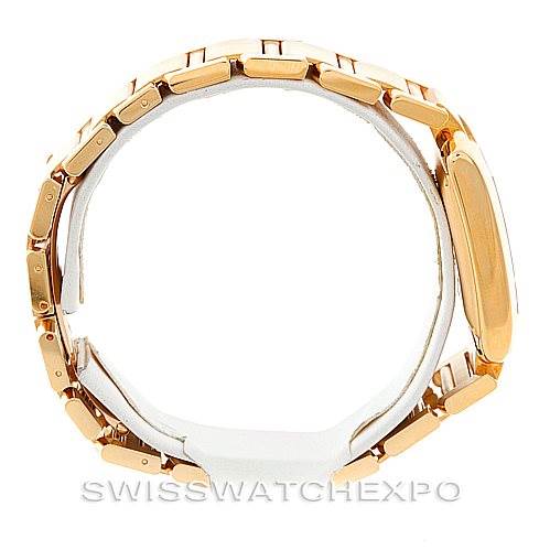 The image shows a side view of the Cartier Tank Française watch, highlighting its gold bracelet and case.