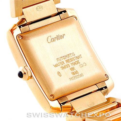 The image shows the back of the Cartier Tank Française watch, focusing on its case back details and part of the gold bracelet.