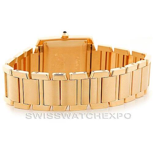 The image shows the back view of the Cartier Tank Française watch, highlighting its gold bracelet and clasp.