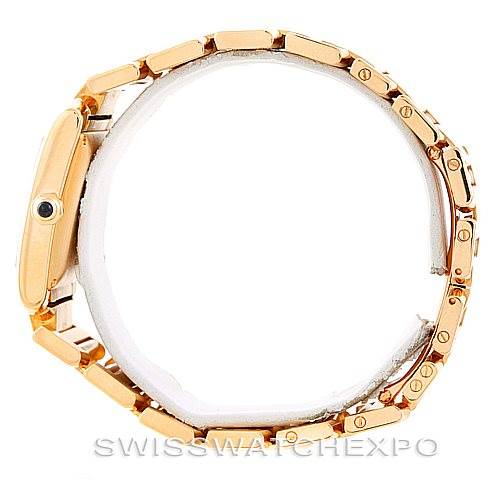 This image shows a side view of the Cartier Tank Française model, highlighting the gold-tone bracelet and crown.