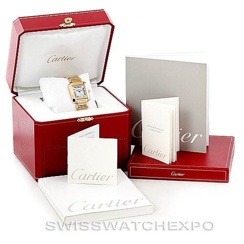 The image shows a Cartier Tank Francaise W50001R2 Men's Yellow Gold Silver Dial W50001R2 Men's Yellow Gold Silver Dial watch in its case, along with associated booklets and packaging from a frontal angle.