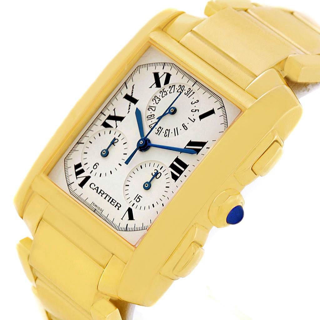 The photo shows the Cartier Tank Francaise W50005R2 Men
s Yellow Gold Silver Dial W50005R2 Men
s Yellow Gold Silver Dial watch from a high-angle view, highlighting the face, band, crown, and pushers.