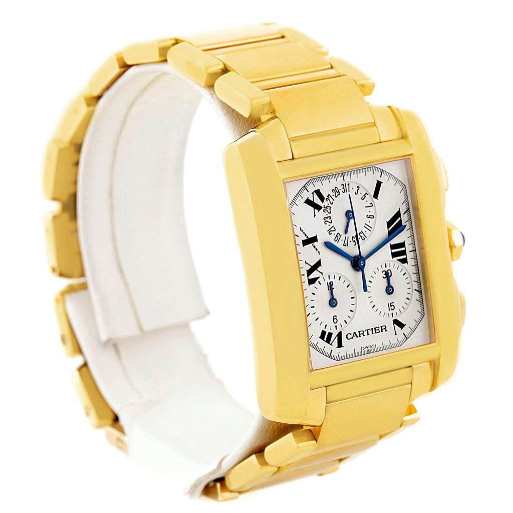 The image shows a Cartier Tank Française watch from a side angle, highlighting the gold casing, bracelet, and dial.