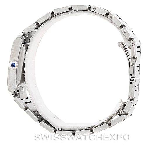 The image shows a side view of the Cartier Tank Française watch, displaying the bracelet and the crown with a blue cabochon.