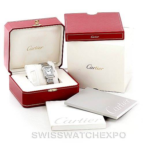The image displays a Cartier Tank Francaise W51002Q3 Men
s Stainless Steel Silver Dial W51002Q3 Men
s Stainless Steel Silver Dial watch in its open red box, with additional packaging and booklets visible.