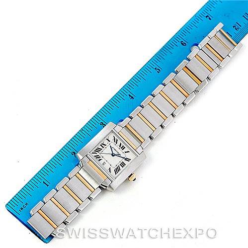 The Cartier Tank Francaise W51005Q4 Men
s Steel and Gold (two tone) Silver Dial W51005Q4 Men
s Steel and Gold (two tone) Silver Dial watch is photographed from a top-down angle, showing its face and two-tone metal bracelet alongside a ruler.