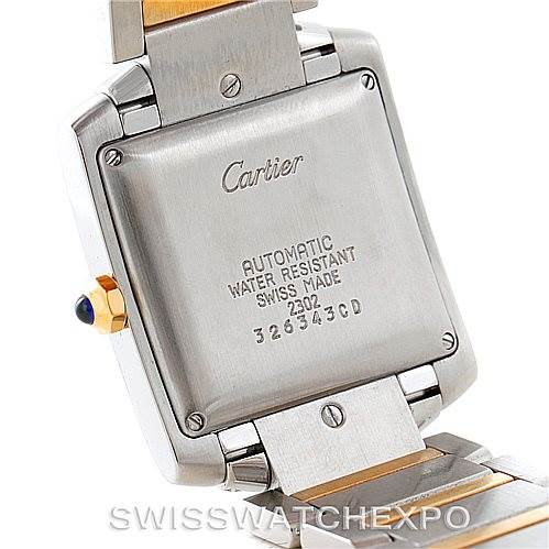 The image shows the back case and part of the bracelet of the Cartier Tank Francaise W51005Q4 Men
s Steel and Gold (two tone) Silver Dial W51005Q4 Men
s Steel and Gold (two tone) Silver Dial watch at a slight angle.