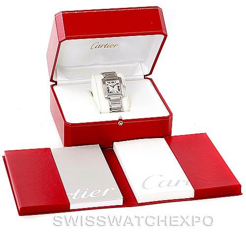 This image shows a Cartier Tank Francaise W51002Q3 Men
s Stainless Steel Silver Dial W51002Q3 Men
s Stainless Steel Silver Dial watch in its presentation box, with additional booklets displayed in the foreground.