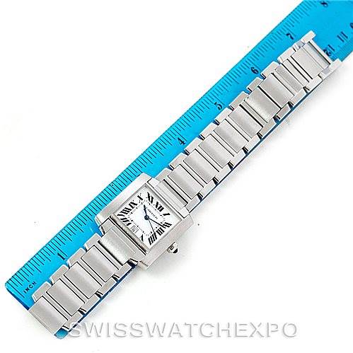 This image shows the Cartier Tank Francaise W51002Q3 Men
s Stainless Steel Silver Dial W51002Q3 Men
s Stainless Steel Silver Dial watch laid flat next to a blue ruler, displaying its face and metal bracelet.