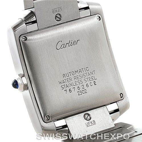 The image shows the back and part of the strap of a Cartier Tank Française watch, highlighting its engravings and screws.
