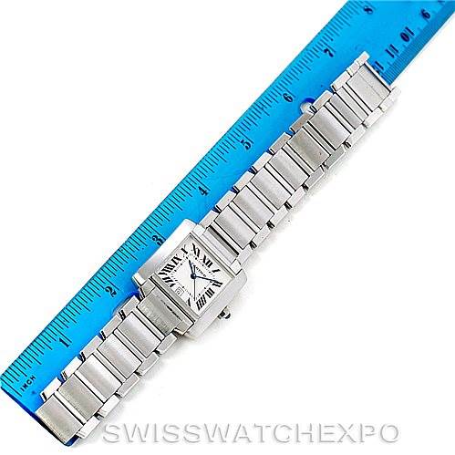 This image shows a Cartier Tank Francaise W51002Q3 Men's Stainless Steel Silver Dial W51002Q3 Men's Stainless Steel Silver Dial watch laid flat next to a blue ruler, displaying the full bracelet and face from a top-down angle.