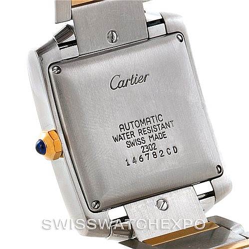 The image shows the back of the Cartier Tank Francaise W51005Q4 Men's Steel and Gold (two tone) Silver Dial W51005Q4 Men's Steel and Gold (two tone) Silver Dial watch, highlighting its inscriptions and part of the bracelet.