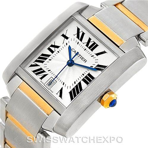 The image shows a close-up of the Tank Francaise watch by Cartier, highlighting the face, crown, and part of the bracelet.