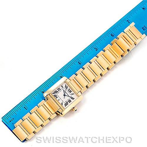 The Cartier Tank Française watch is shown in a top-down view with a ruler to measure the bracelet length.