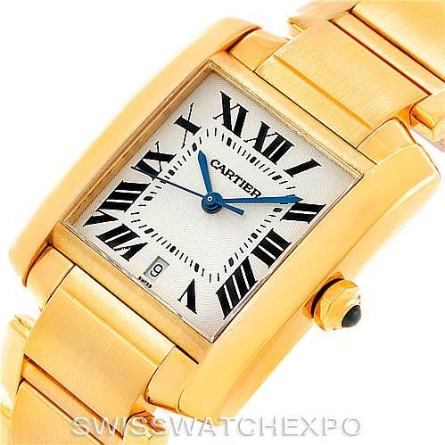 This image shows the face and bracelet of a Cartier Tank Française watch at an oblique angle, highlighting its gold color and Roman numerals.
