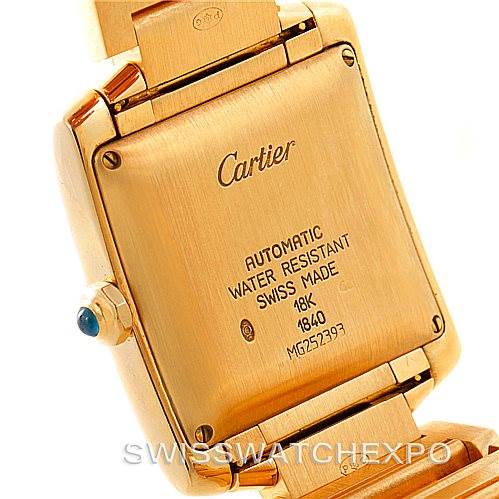 This image shows the back case and part of the bracelet of the Cartier Tank Francaise W50001R2 Men
s Yellow Gold Silver Dial W50001R2 Men
s Yellow Gold Silver Dial watch.