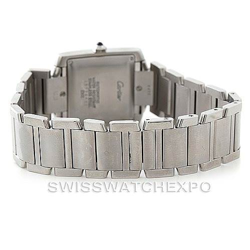 The image shows the back and part of the bracelet of a Cartier Tank Française watch.