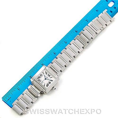 The Cartier Tank Francaise W51002Q3 Men's Stainless Steel Silver Dial W51002Q3 Men's Stainless Steel Silver Dial watch is shown laid flat next to a ruler, displaying its face, band, and clasp.