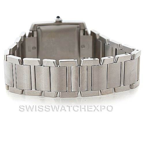 The image shows the back view of a Cartier Tank Française watch, focusing on the stainless steel bracelet and clasp.