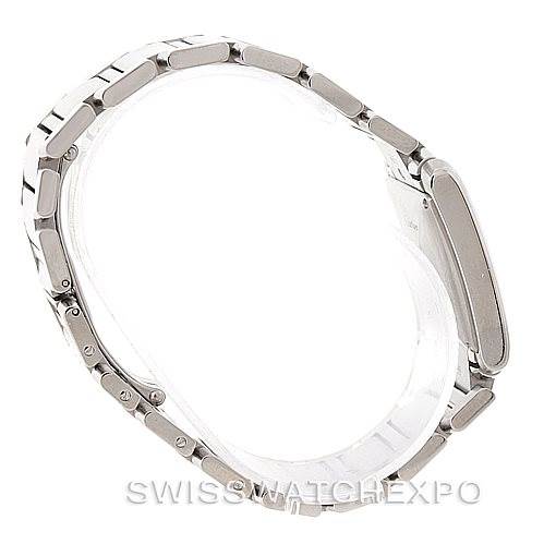 The image shows a side view of the Cartier Tank Française watch, focusing on its stainless steel bracelet and case.