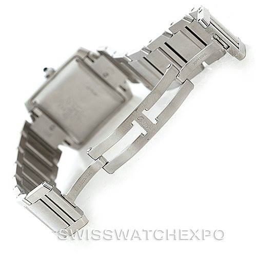 This image shows the back and bracelet clasp of a Cartier Tank Française watch at a tilted angle.