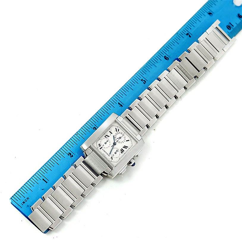 The Cartier Tank Francaise W51001Q3 Men
s Stainless Steel White Dial W51001Q3 Men
s Stainless Steel White Dial watch is displayed flat, showcasing the entire face and metal bracelet with a ruler for size reference.