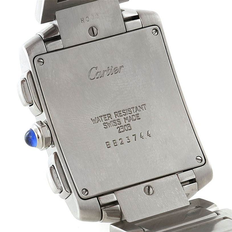 This image shows the back case and part of the bracelet of the Cartier Tank Française watch, highlighting the engravings and crown.