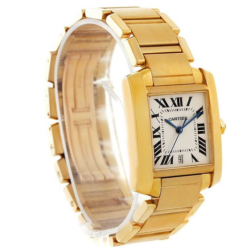 This image shows a Cartier Tank Francaise W50001R2 Men
s Yellow Gold Silver Dial W50001R2 Men
s Yellow Gold Silver Dial watch angled to display its rectangular face and gold bracelet.