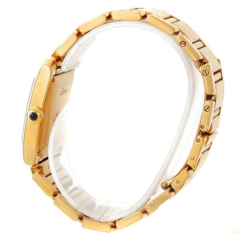 The image shows a side view of the Cartier Tank Française watch, highlighting its gold case and bracelet.