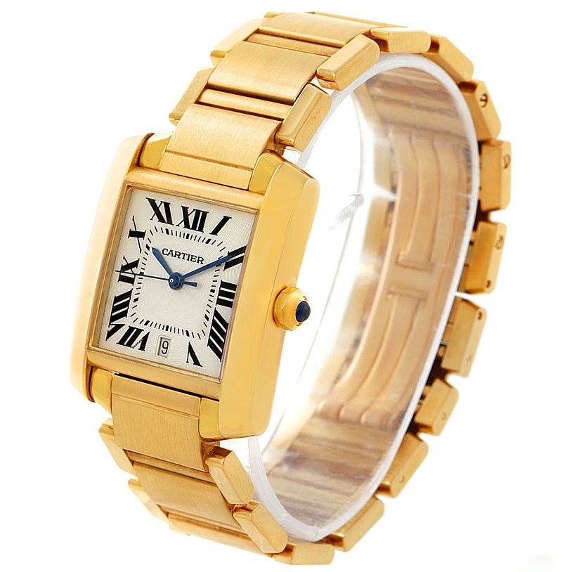 The image shows a Cartier Tank Française watch from a side angle, highlighting the gold case, bracelet, and dial with Roman numerals.