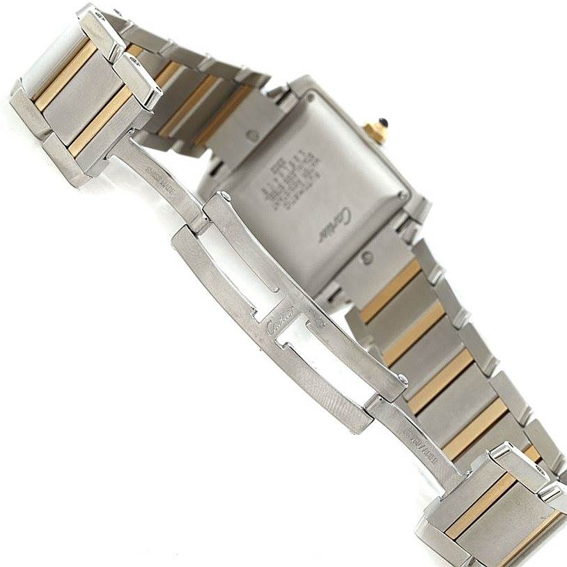 The image shows the deployment clasp and backside of the bracelet of a Cartier Tank Française watch.