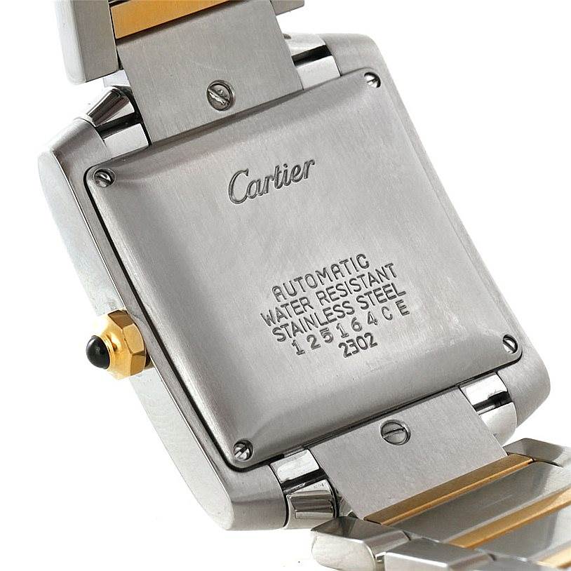 The image shows the back case of a Cartier Tank Française watch and part of its two-tone bracelet.